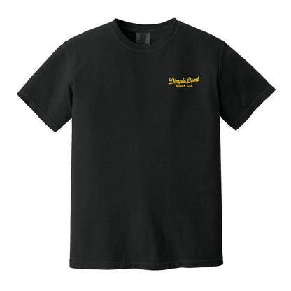 A black short-sleeve crewneck t-shirt with yellow logo text on the left chest reading 'Dimple Bomb Golf Co.' on a plain white background.