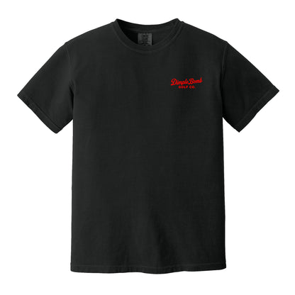Black Public Course Tee featuring a small red Dimple Bomb Golf Co. left chest logo on a Comfort Colors heavyweight golf shirt.