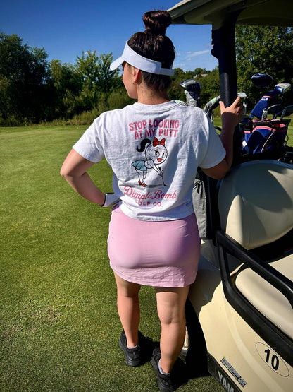  Dimple Golf Shirt White on a Lady leaning of Golf Cart